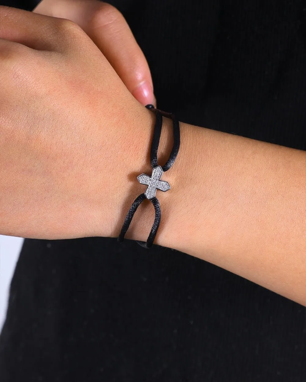 MOISSANITE CROSS CORD BRACELET.