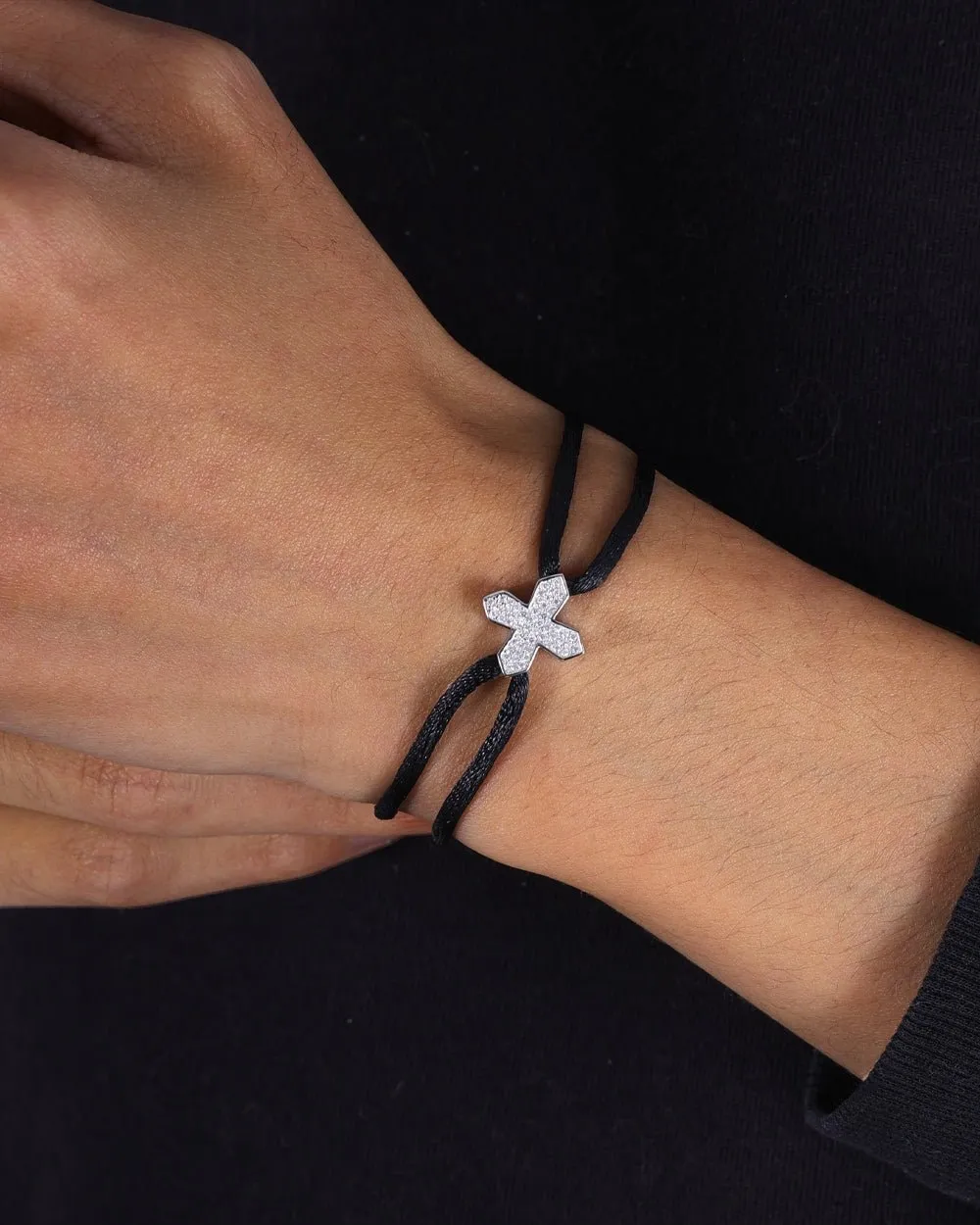 MOISSANITE CROSS CORD BRACELET.